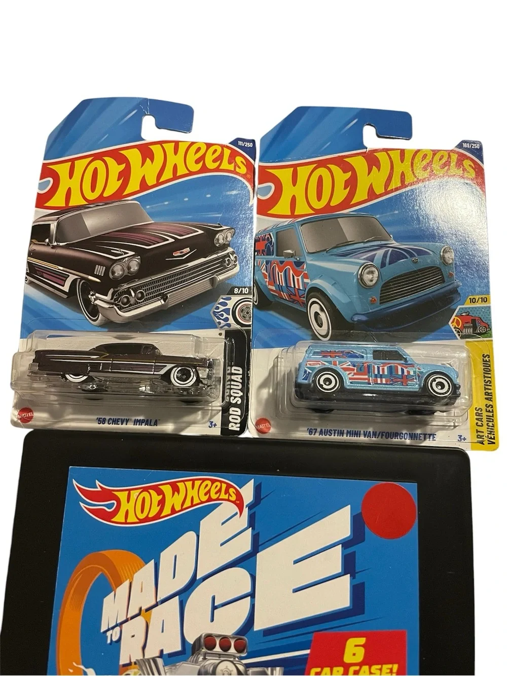 Hot Wheels die-cast cars still sealed in original packaging with 6 car case